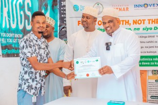 participants with attendance certificates at the end of the training.