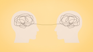 An illustration of two heads with scribble lines connecting both.